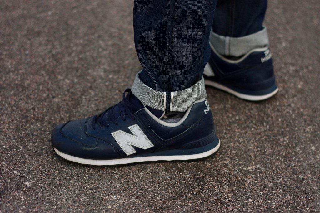 mens selvedge jeans ankle view with New Balance 574 shoes