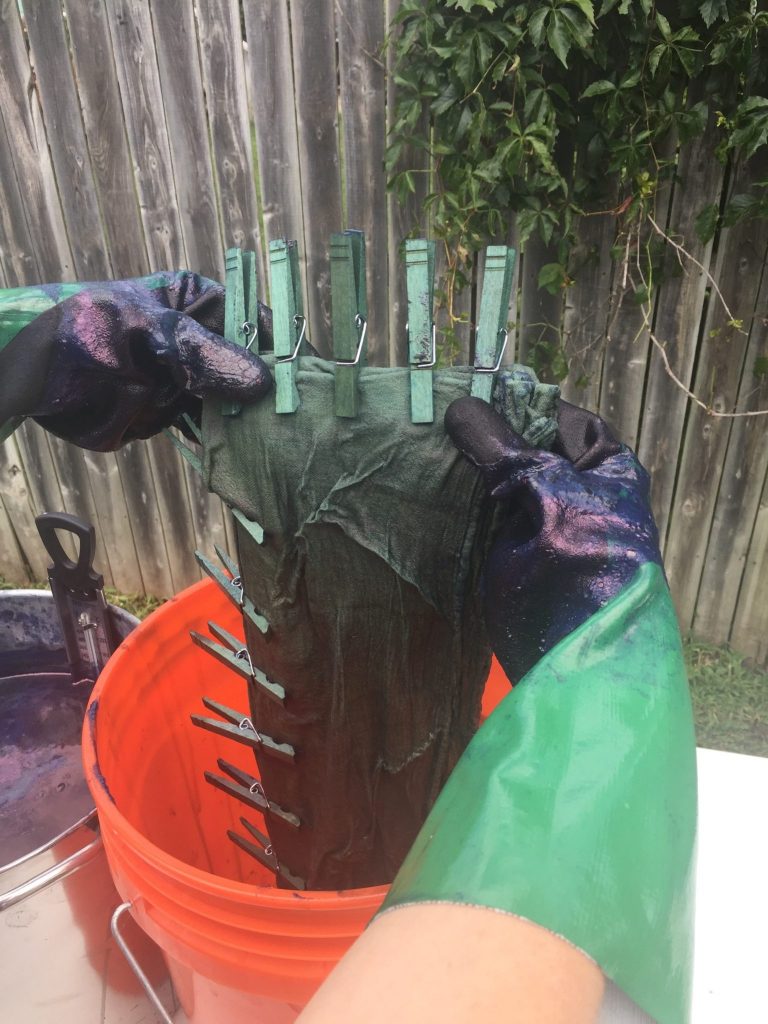 Tea towel coming out of the indigo dye pot